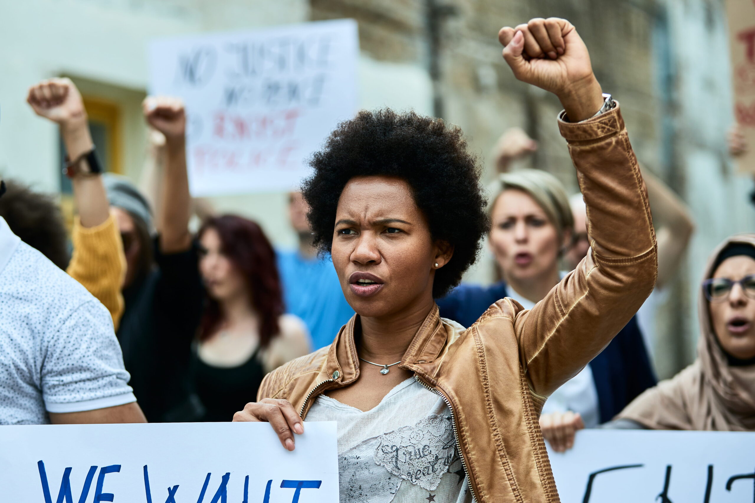 displeased-black-woman-crowd-people-demonstrating-against-racism-city-streets (1)